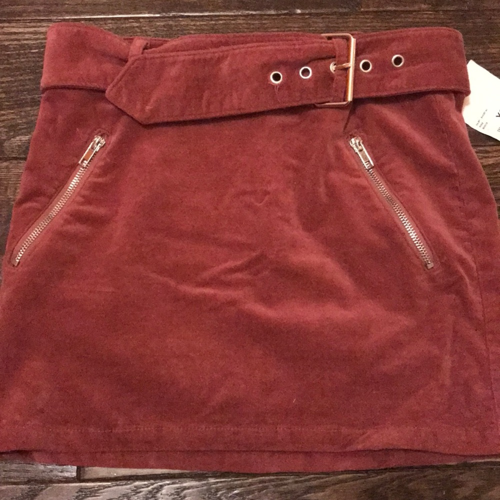 Dark red buckle mini skirt
